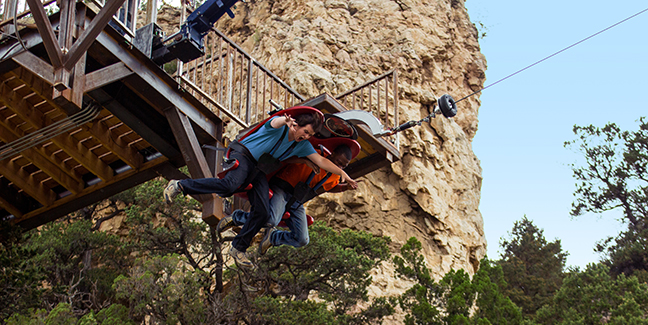 Two men on cave park amusement ride in Colorado Springs
