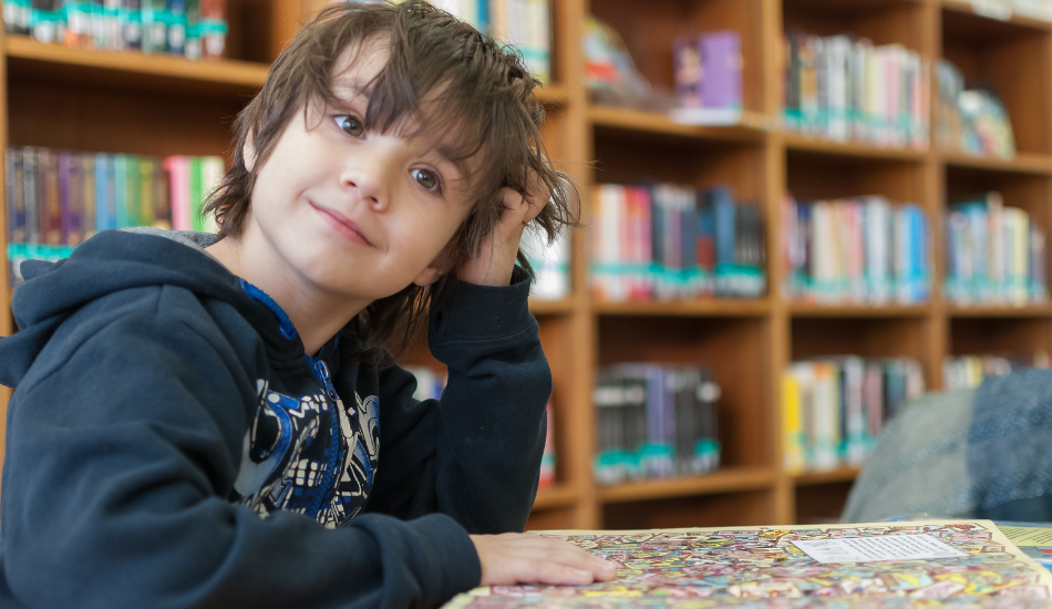 Little boy on a field trip at his public library